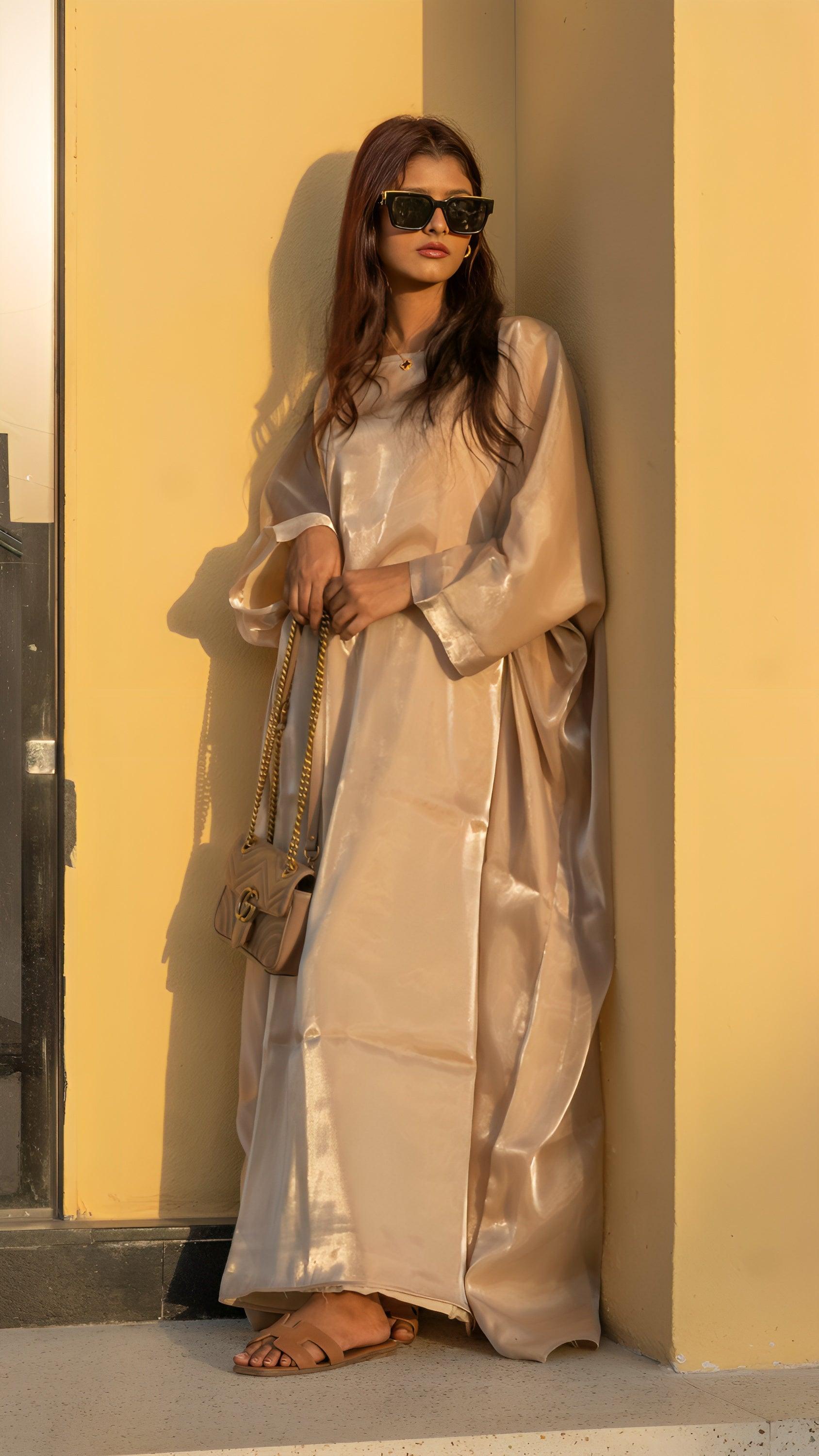Fashion model showcasing a luxurious butterfly abaya